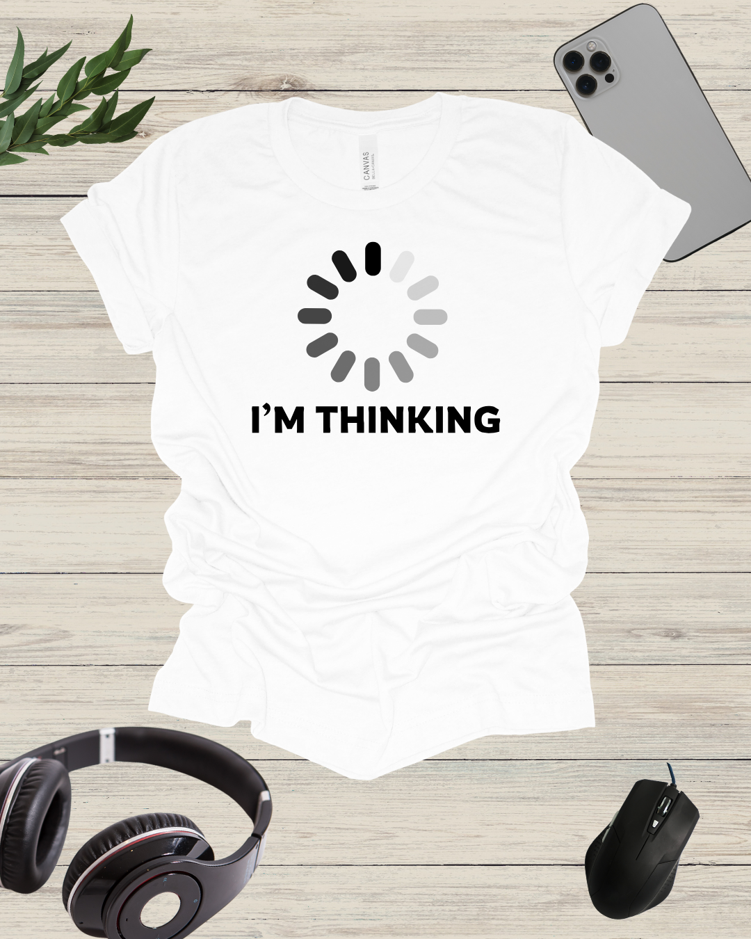 a white t - shirt that says i'm thinking with headphones and a