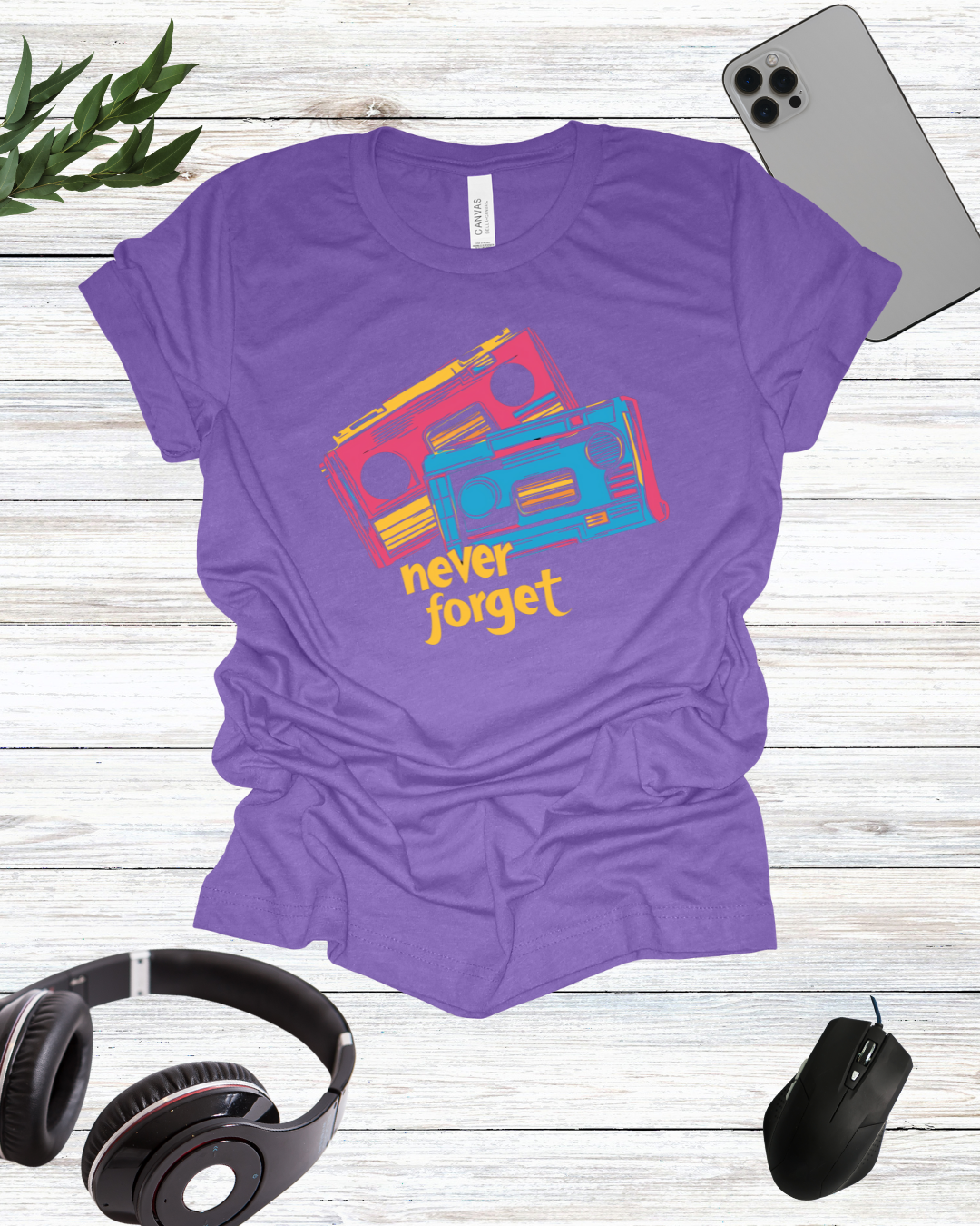 a purple shirt that says never forget with headphones and a pair of headphones